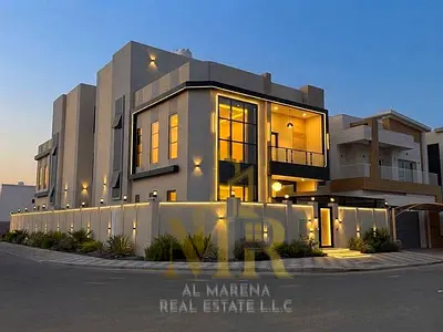A distinctive villa for sale in the Al Yasmeen area, Ajman. It features two floors plus a roof terrace and boasts a strategic corner location. The pri