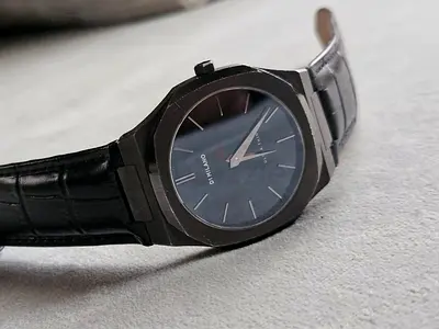 Black men's wristwatch with leather strap - sleek minimalist design
