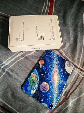 iPad Mini with colorful space-themed case (box included)