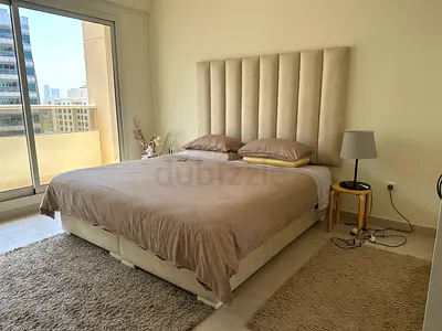 King size (200x200) upholstered bed with tall padded headboard - beige