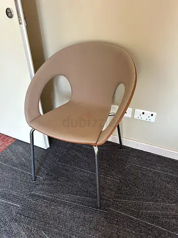 Modern beige plastic dining/office chair with metal legs