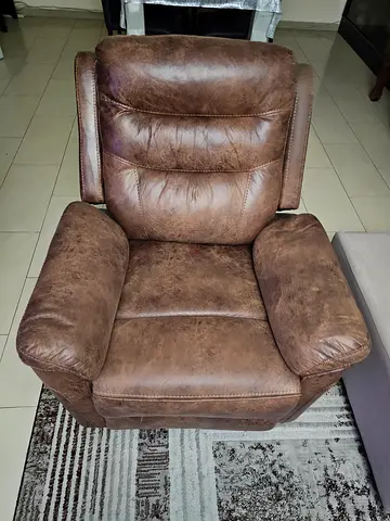 Brown leather recliner armchair in used good condition.