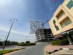 Residential-commercial plot for sale in Ajman, Al Rawda 2 area, located directly on Sheikh Maktoum b