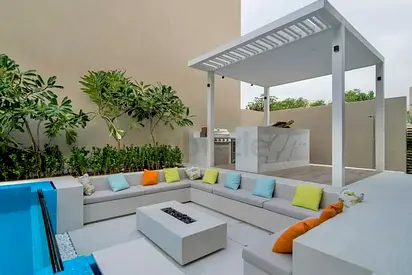 Outdoor L-shaped Built-in Concrete Seating with Pergola and Firepit