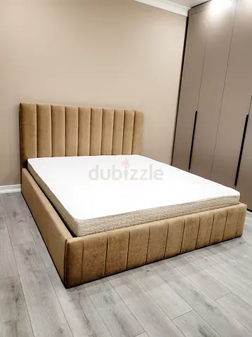 Valvet upholstered King bed with paded headboard