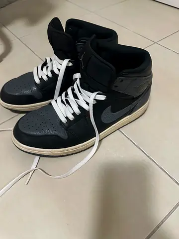 Black and grey Nike Jordans