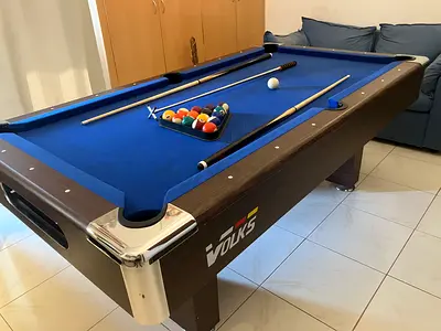 Well loved pool table. 7 by 4 ft. Cushions slightly soft. Perfect for a family.