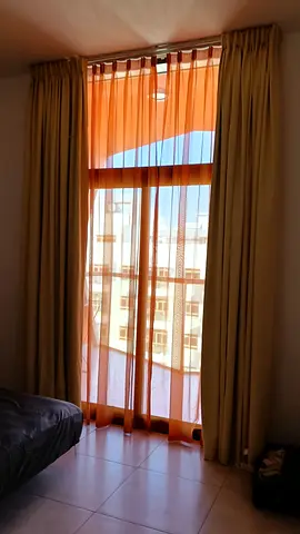 Beige blackout curtains with sheer orange inner panels - set for balcony sliding door