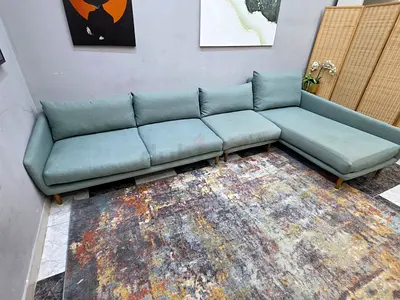 Light teal L-shaped sectional sofa, good condition