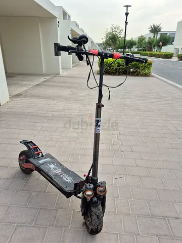 Used electric kick scooter with dual suspension and off-road tires (broken) but fixable