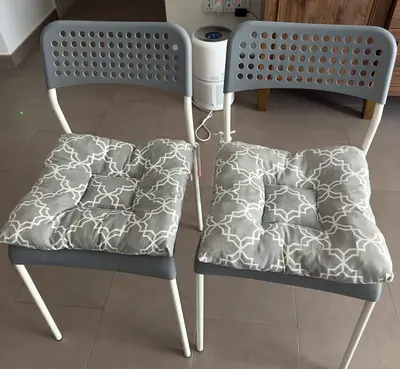 Set of 2 grey metal dining chairs with seat cushions - good condition