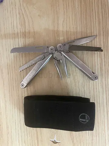 Leatherman Wave-style stainless steel multi-tool with sheath