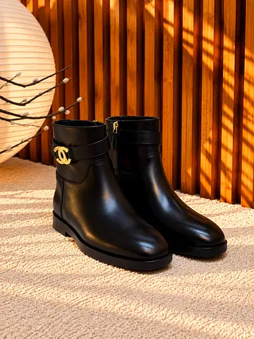 Black leather ankle boots with gold buckle detail - size available