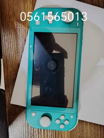 Turquoise Nintendo Switch Lite - Good Working Condition 128gb loaded with games