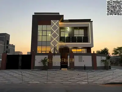 A luxurious villa for sale in Al Yasmeen, featuring a modern design and spacious interiors. Ideally located near all amenities, the price includes reg