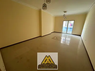 2BR in Al Nuaimiya 3, balcony, central AC, free parking. AED 44K negotiable, 4 payments, AED 5K cheque deposit.