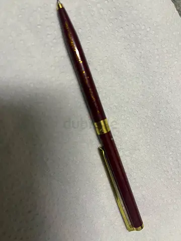 Vintage maroon ballpoint pen with gold trim