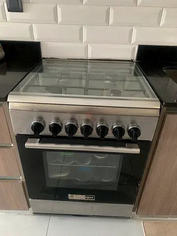 Medium stainless steel gas oven and stove - good working condition