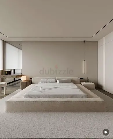 Modern upholstered king-size bed with plush headboard and base
