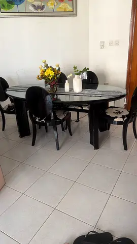 Black marble-top dining table with 6 chairs — good condition