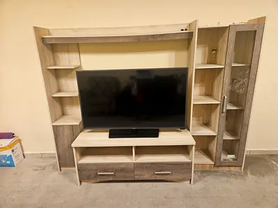 TV table , Light wood entertainment center with shelving and glass display cabinet