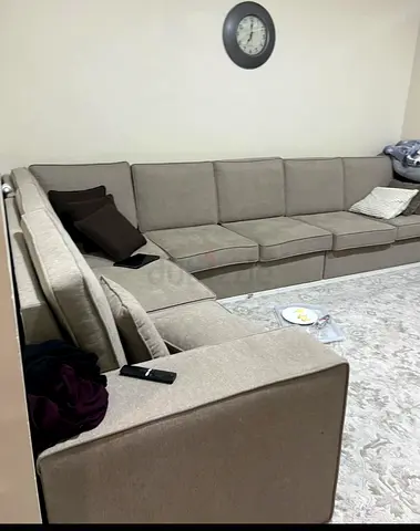Large L-shaped beige fabric sectional sofa - good condition TV Unit from Home Centre