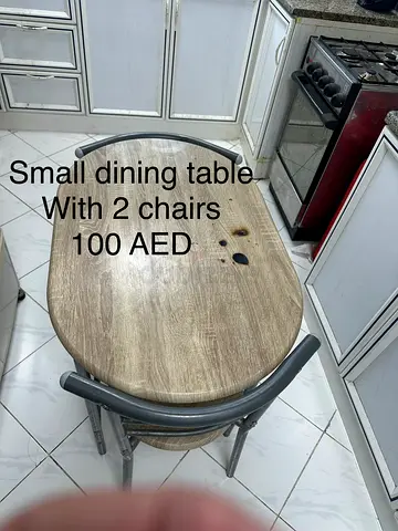 Small oval dining table with 2 chairs - used, AED 100