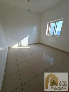 One-bedroom apartment with a living room in Al Butina, Sharjah—second occupancy. Features a spacio