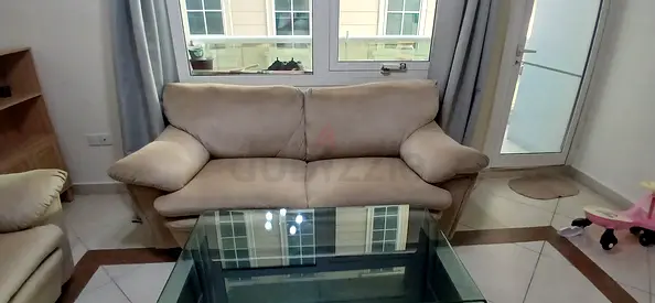 Beige 5-seater fabric sofa in good used condition