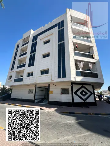 Two-bedroom apartment with a living room for rent in Al Nuaimiya 2; features a balcony and central