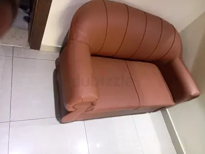 Compact two-seater brown faux leather sofa — good condition