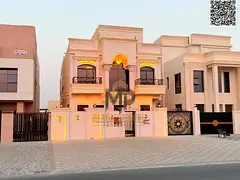 A luxurious classic-style villa in Al Helio 2, situated on a main road. It features a 15-meter front