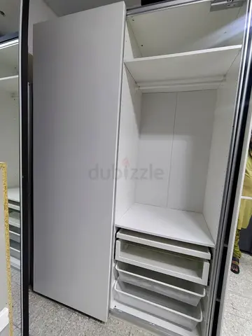 White sliding-door wardrobe with drawers and shelves - good condition