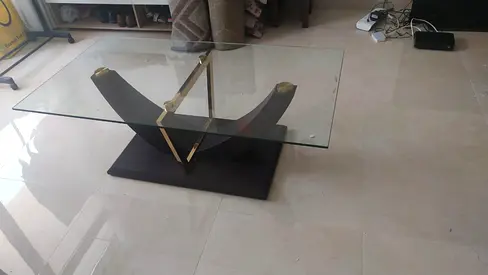 Glass Top Coffee Table with Dark Wood Base and Brass Accents