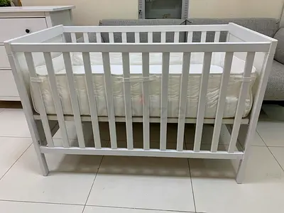 White wooden baby crib / cot in good condition