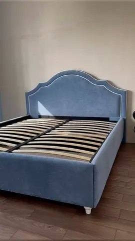 Grey upholstered double bed frame with headboard