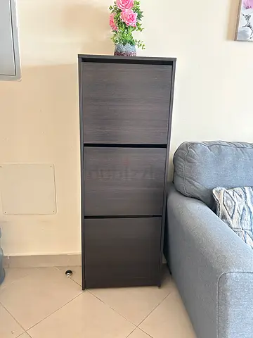 Slim dark wood 4-drawer storage cabinet — good condition