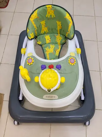 Used baby walker with giraffe print seat - good condition