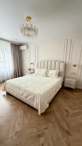 Modern upholstered king-size bed with plush headboard and base