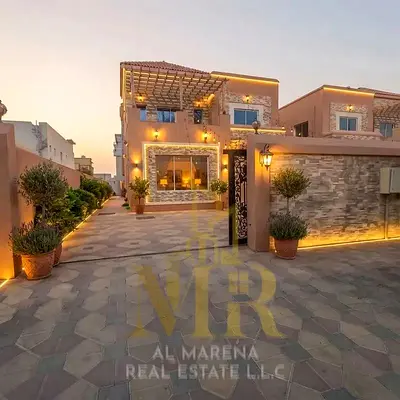 Villa for sale in Al Rawda 3 | Located on a street and a side lane; features 5 bedrooms, a majlis, and two living rooms | Includes electricity, water,