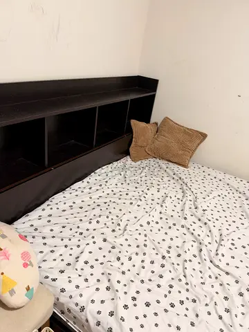 Queen bed frame with built-in headboard shelving (dark wood)