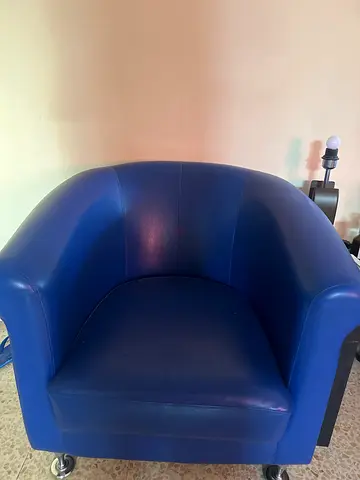 Red and Blue leather swivel club chair on casters - good condition and center table
