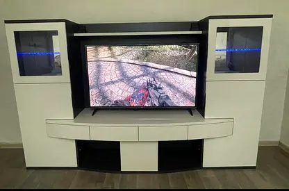 Modern white and black entertainment center TV unit with display cabinets