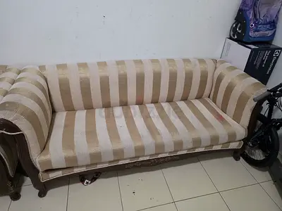 Three-seater striped beige sofa, classic wooden frame