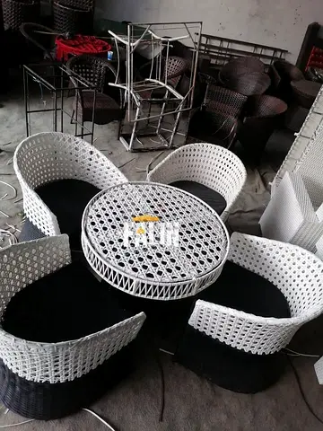 White and black rattan outdoor 4-seater lounge set with table