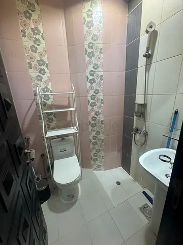 Small room with attached bathroom in a villa