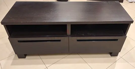 Dark wood TV stand with two drawers and open shelves