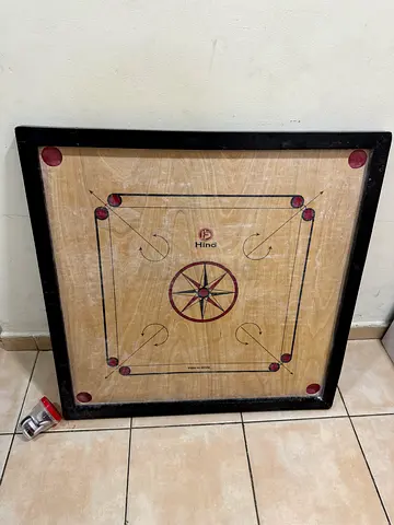 Carrom Board with Coins and Powder
