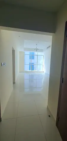For rent: 2-bedroom apartment with a living room (including one master bedroom) in Al Khan. Features a side view and a dedicated parking space.