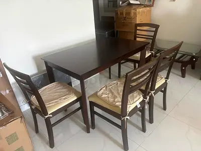 Dark wood 4-seater dining table with chairs - good condition